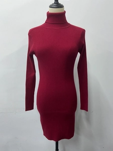 Detailed view of the vertical ribbed texture on this dark red turtleneck knit dress