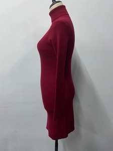 Detail view of the deep red ribbed knit texture on this slim-fit turtleneck dress