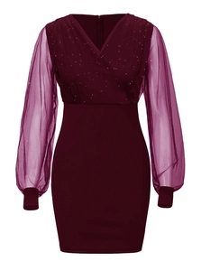 Detailed view of burgundy mesh V-neck bodice featuring sparkling silver sequins