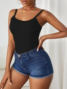 Close-up of black ribbed slim-fit tank top with elastic vertical texture and crew neck