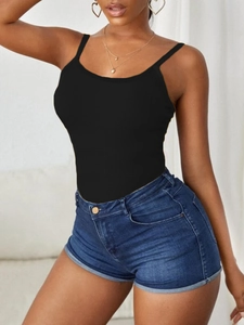 Close-up of the ribbed cotton texture and slim fit design of this black camisole top