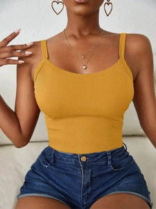 Close-up of ginger yellow rib-knit tank top fabric texture and round neckline detail