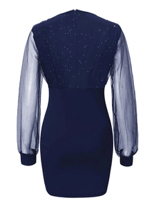 Detail view of navy blue dress featuring mesh back with sequins and invisible zipper