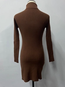 Detail of a brown high-neck ribbed knit dress showing the thick elastic vertical texture
