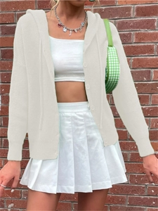Detailed view of the white knitted hooded cardigan with vertical texture and button closure