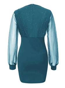 Detail of teal evening dress showing sheer mesh sleeves with sequins and a back zipper