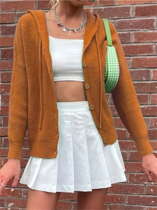Close-up of caramel hooded knit cardigan with button closure and drawstring details