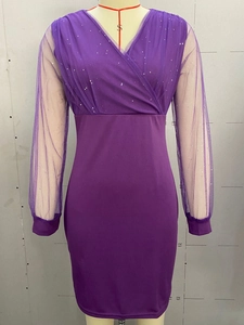 Close-up of purple V-neck mesh dress featuring silver sequins and elegant wrap design