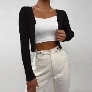 Close-up of black ribbed knit cardigan with button details and slim-fit texture