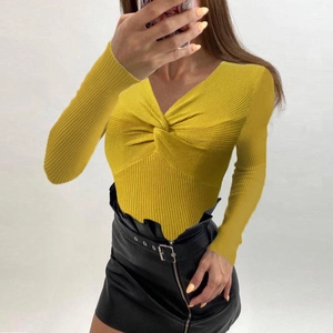 Women's mustard yellow long sleeve knit sweater with V-neck twist front and ribbed texture