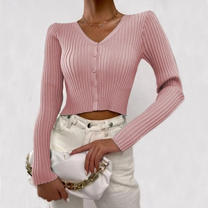Close-up of pink button-up cardigan featuring ribbed knit texture and stylish V-neck design