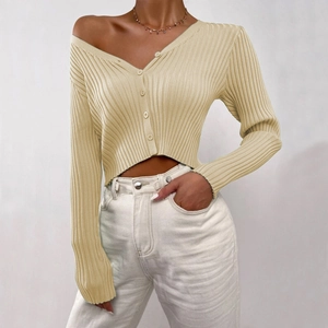 Detailed close-up of a women's beige V-neck button-up ribbed knit cardigan sweater coat