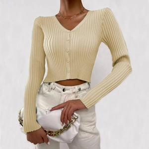 Detail of beige ribbed knit cardigan featuring V-neckline and button-down front closure