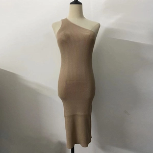 Close-up of one-shoulder asymmetric neckline on khaki ribbed knit bodycon midi dress