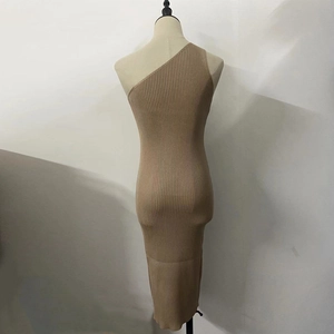 Detail of camel rib-knit texture and one-shoulder cut on a bodycon knit dress