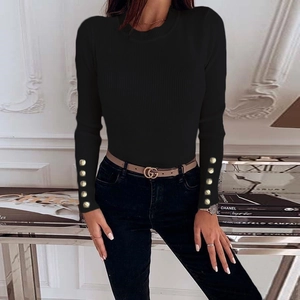 Women's slim fit black ribbed knit sweater with decorative gold buttons on long sleeves