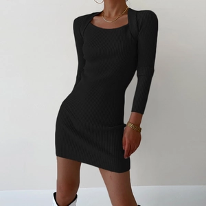 Close-up of black ribbed knit long sleeve dress with square neck and bodycon fit