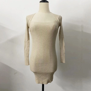 Detail of square neck and ribbed knit texture on a beige long sleeve dress
