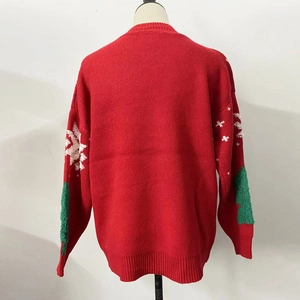 Rear view of festive red Christmas sweater with knitted snowflakes and tree patches