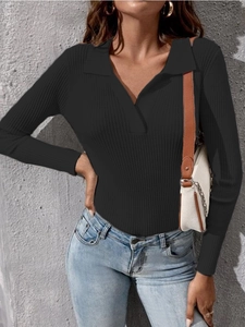 Detail of black ribbed knit polo sweater with V-neckline and slim fit long sleeves