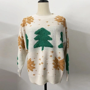 Detailed view of the 3D tufted green Christmas trees and golden snowflakes on the sweater