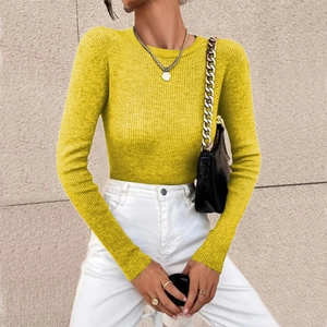 Detail of ribbed knit texture on a slim fit bright yellow long sleeve crewneck sweater