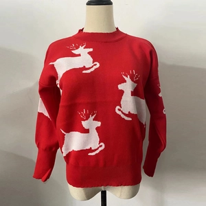 Detail view of red Christmas knit sweater with white reindeer jacquard pattern