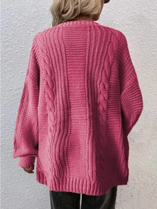 Back view of a casual loose fuchsia knitted cardigan with cable knit texture and ribbing