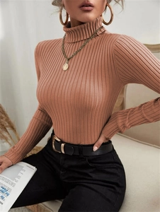 Detail of tan ribbed high neck sweater with slim fit and long sleeves on model