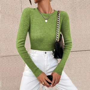 Detail of green ribbed knit sweater showing the vertical texture and crew neck design