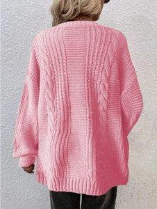 Detail of pink cable knit texture on oversized open front cardigan sweater for women
