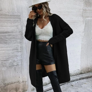 Women's loose long black knit cardigan sweater with ribbed cuffs for casual autumn style