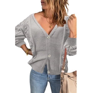 Women's gray knit cardigan with V-neck, relief buttons and decorative textured pom-poms