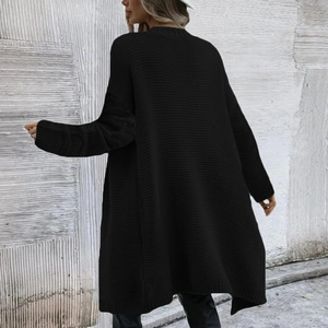 Detail view of black chunky knit oversized cardigan with cable stitch cuffs and long fit
