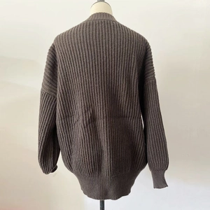 Rear view of loose V-neck knit cardigan with ribbed texture in deep coffee brown color