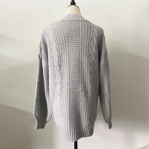 Macro view of the grey cable knit cardigan back showcasing premium wool texture