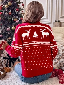 Back view of a festive red Christmas sweater with reindeer and snowflake knit patterns