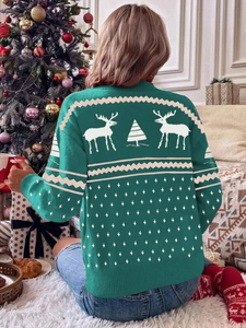 Rear view of festive green Christmas sweater with white reindeer and snowflake knits