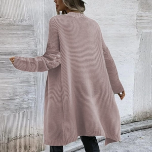 Detail of chunky knit texture on pink oversized cardigan sweater from the back