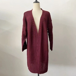 Detail of burgundy chunky knit cardigan showing vertical texture and oversized fit