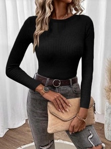 Detailed view of women's black ribbed knit crewneck sweater with long sleeves in slim fit