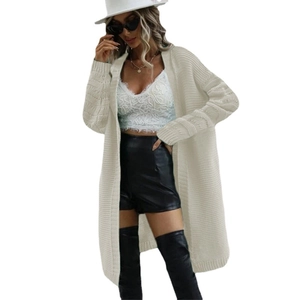 Women loose knit cardigan in cream white paired with lace top and black leather pants