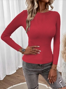 Close-up detail of red slim-fit ribbed knit sweater with crew neck and vertical texture