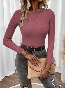 Detail shot of dusty pink slim fit knit sweater with vertical ribbed texture and crew neck