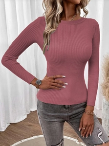 Detailed texture of dark pink ribbed knit sweater with crew neck and long sleeves