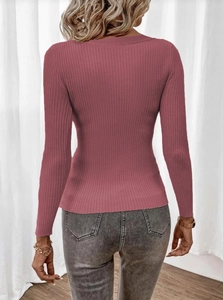 Close-up of the dusty pink ribbed knit texture and slim fit design on women's sweater