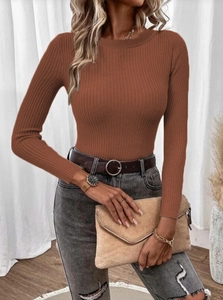 Close-up of rust red ribbed knit sweater featuring a crew neck and long sleeves