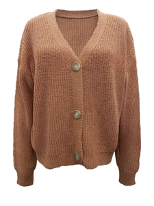Detail of caramel brown V-neck knit cardigan with large buttons and ribbed cuffs