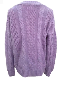 Detail of purple cable-knit cardigan showing chunky weave and ribbed cuffs on white background