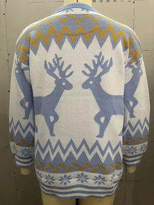 Detail of the reindeer and snowflake knit pattern on the back of the Christmas sweater
